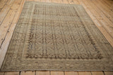 Distressed Herati pattern and abrashes on a vintage Malayer rug in neutral tones.
