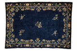 Antique Peking carpet with scattered floral sprays on a cobalt blue field and a floral bine border.