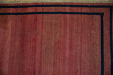 Antique Doroksh rug corner with even wear, a navy blue border, and secured fringed end.