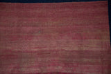 Expertly rewoven navy blue selvage on an antique Doroksh rug with time-softened raspberry pile.