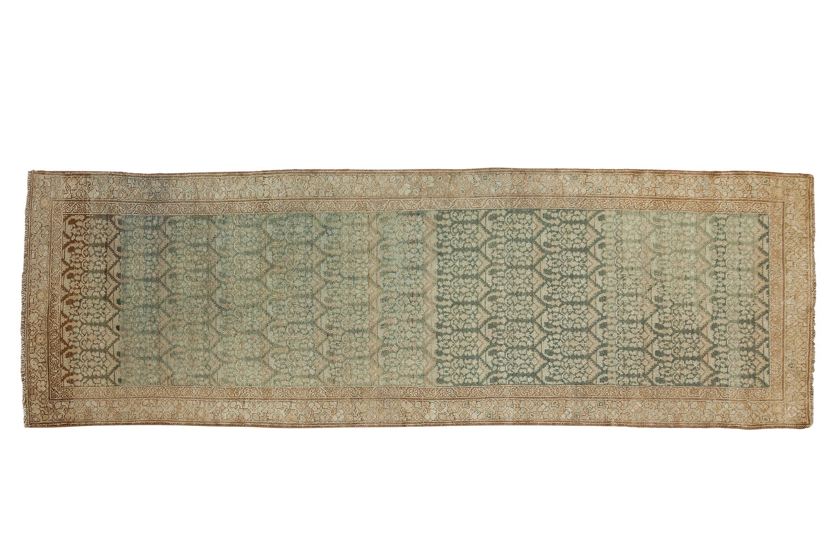 Distressed vintage Malayer runner with a dense boteh pattern and visible abrash in dusty teal and coffee brown.