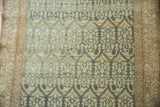The distressed low pile of a vintage Malayer runner showing the allover boteh relief pattern.