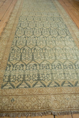 Low angle view of a vintage Malayer runner showing its allover boteh pattern and slight ripple.