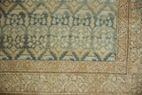 Textured boteh relief with visible knot heads in dusty teal and antique ivory on a Malayer rug.