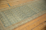 Long angled view of a distressed Malayer runner, showing its soft abrash and rippled texture.