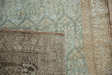 Hand-knotted foundation and distressed teal pile shown on a vintage Malayer rug corner.
