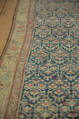 Distressed antique Kurdish Hamadan runner: dusty blue field with geminating plants, ivory border.