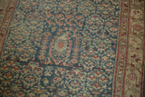 Side border and patterned field of antique distressed Kurdish Hamadan runner.