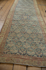 Distressed Kurdish Hamadan runner, geminating plant pattern in dusty sapphire blue, ivory, and madder red.