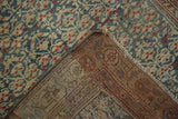Distressed antique Kurdish Hamadan rug pile in blues, ivory, reds, revealing woven foundation.