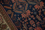 Stylized herdsmen and animal figures on the sapphire blue field of an antique Persian Malayer rug.