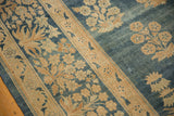 Antique Kerman carpet with distressed denim blue abrashed ground, ivory floral bouquets, millefleur border.