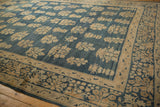 Faded millefleur border design and distressed floral field on the antique Kerman carpet.