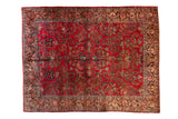 Vintage American Sarouk carpet with a dense allover pattern of floral sprays on a rich cherry red field, 9x11.5.