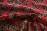 The silk-like sheen of the hand-knotted wool pile on a transitional Mohajeran Sarouk rug.