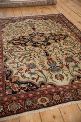 Perspective view of a fine Farahan Sarouk rug's hand-knotted low pile and central medallion.
