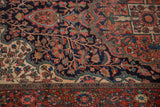 Detail of the antique Farahan Sarouk's sprawling tree of life design elements and dense ornamentation.