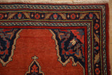 Close-up of a vintage Bijar corner, detailing the navy spandrel and floral border motifs.