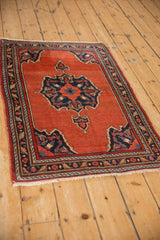 Angled perspective of a vintage Bijar rug showing the rich color and traditional medallion design.