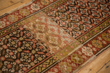 Vintage Kurdish runner's repeating leaf and blossom design with heavy color abrasions.