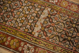 Vintage Kurdish runner: charcoal, green gold, dusty rose leaf, blossom pattern, and restoration.