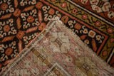 Kurdish rug folded corner showing madder red leaf pattern pile and hand-knotted foundation.