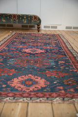 Perspective view showing the grand scale and bold gul medallions of an antique Caucasus Soumac runner.
