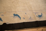 Stylized sapphire blue motifs on an antique ivory field of a Chinese Art Deco border.