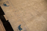 Reverse side of the antique Art Deco carpet with scattered residual pad remnants.