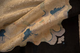 Antique Art Deco rug pile, showing stylized sapphire blue, ivory, and subtle charcoal motifs.