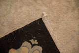 Antique Chinese Art Deco carpet reverse corner, showing black foundation and old pad remnants.