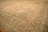Distressed Mahal carpet corner showing soft blush field, floral palmettes, and detailed vine border.