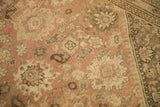 Worn dusty blush and ivory floral palmettes, arabesques, and silver-toned Mahal border.