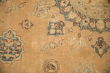 Detail of vased tree of life plants in sky blue and sand on the time-softened, low-pile field of a Yezd carpet.