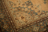 Corner spandrel detail of an antique Persian Yezd carpet showing its distressed texture.