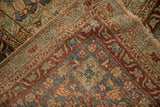 The hand-knotted foundation and restored side cord selvage of a distressed antique Persian rug.