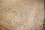 Angled view of a vintage Tabriz carpet's allover Herati field and classic turtle motif border.