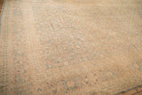 Wide perspective across the vintage Tabriz carpet's tea-washed Herati field and borders.