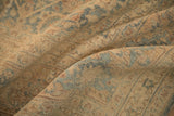 Softly draped view of the vintage Tabriz rug's low pile and even, time-softened wear.