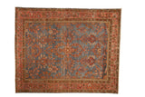 Vintage distressed Persian Mahal rug with floral tree-of-life designs over an abrashed blue field.