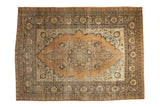 Antique Haji Jalili Tabriz carpet with a roundel medallion, floral arabesques in camel, blue, and ivory, size 8'8
