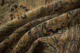 Soft, tea-washed pile of an antique Tabriz showing Rococo arabesques in camel, navy, and dusty blue.