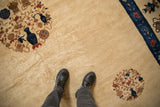 Scale and texture of an antique Peking carpet with Daoist-inspired roundel medallions.