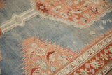 Detail of the lightning serrated medallion against the abrashed powder blue field on an antique Karabagh rug.