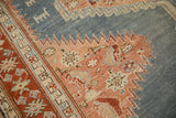 Worn pile of an antique Karabagh rug with lightning serrated edges and animal motifs.