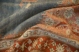 Textured low pile of an antique Karabagh rug with a powder blue field and red serrated border.