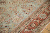 Herati-inspired terra cotta border and dusty blue field of a distressed vintage Persian Mahal carpet.