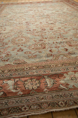 Worn texture of a vintage Mahal carpet with terra cotta palmettes on a dusty blue ground.