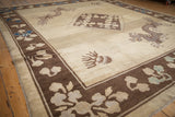 A five-toed dragon motif alongside the geometric medallion of an antique Peking carpet.