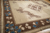 Angled view of a five-toed dragon and sapphire blue florals on an antique Peking carpet.
